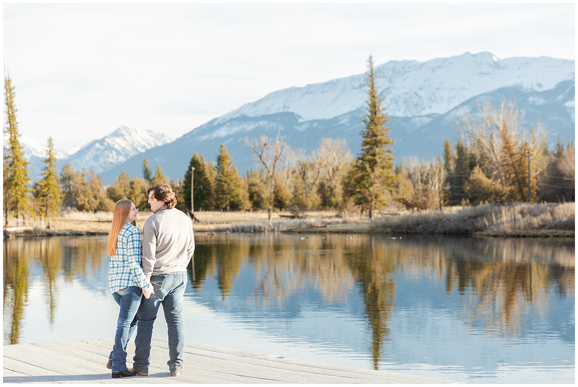Engaged couple on a dock at a pond in Enterprise, Oregon