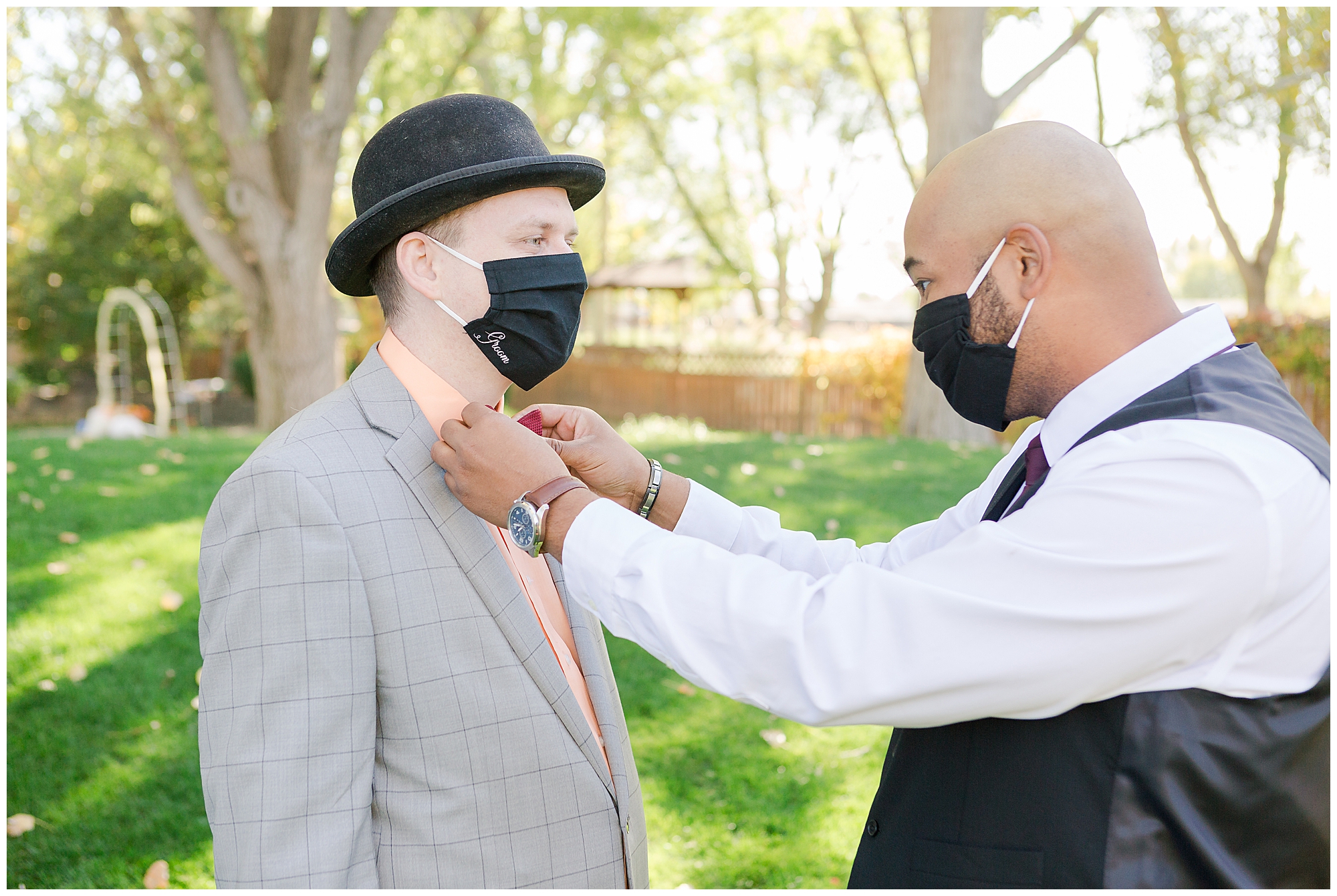 The groom's brother straightens his bowtie as they await the bride's arrival