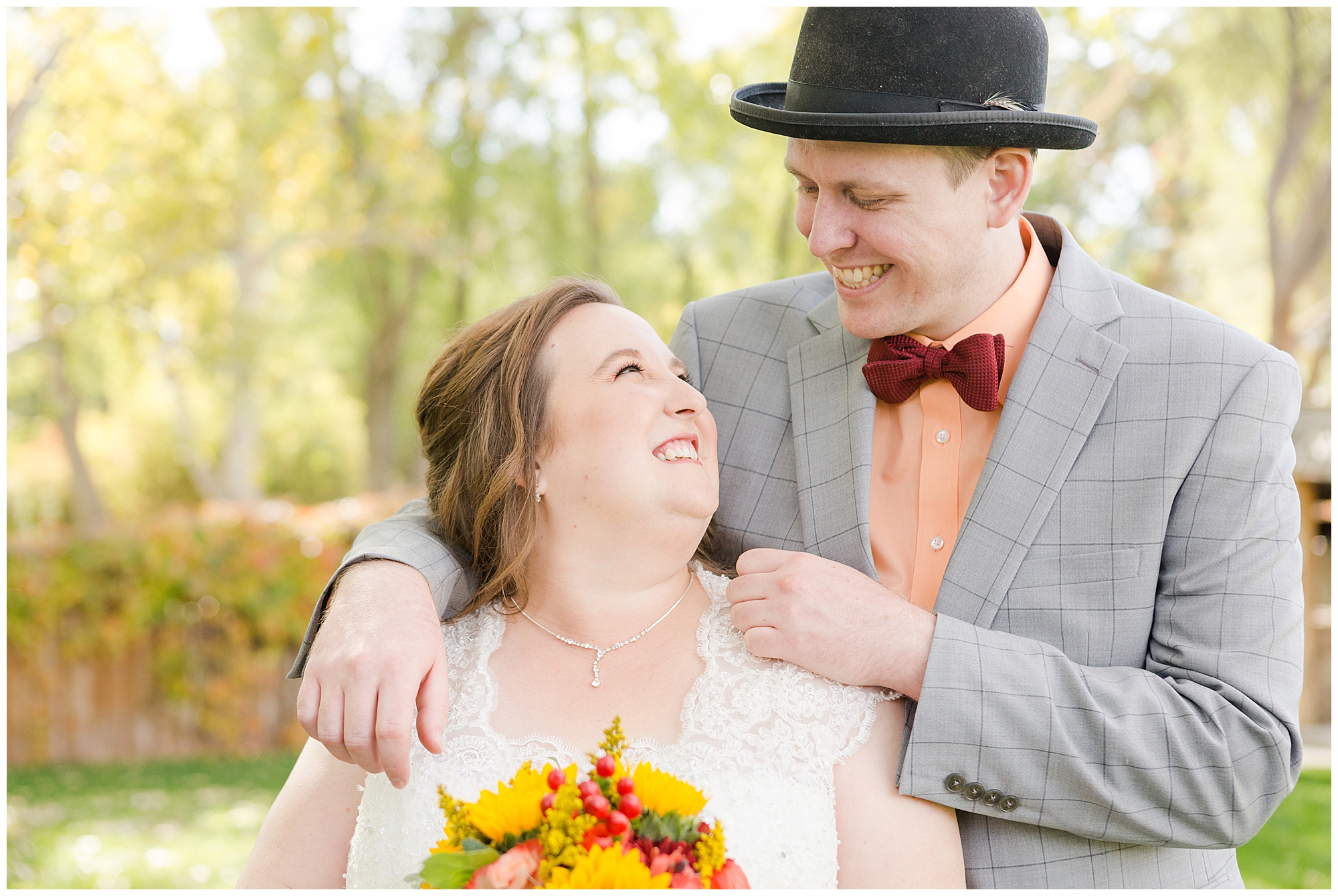 Bride and groom smiling at each other