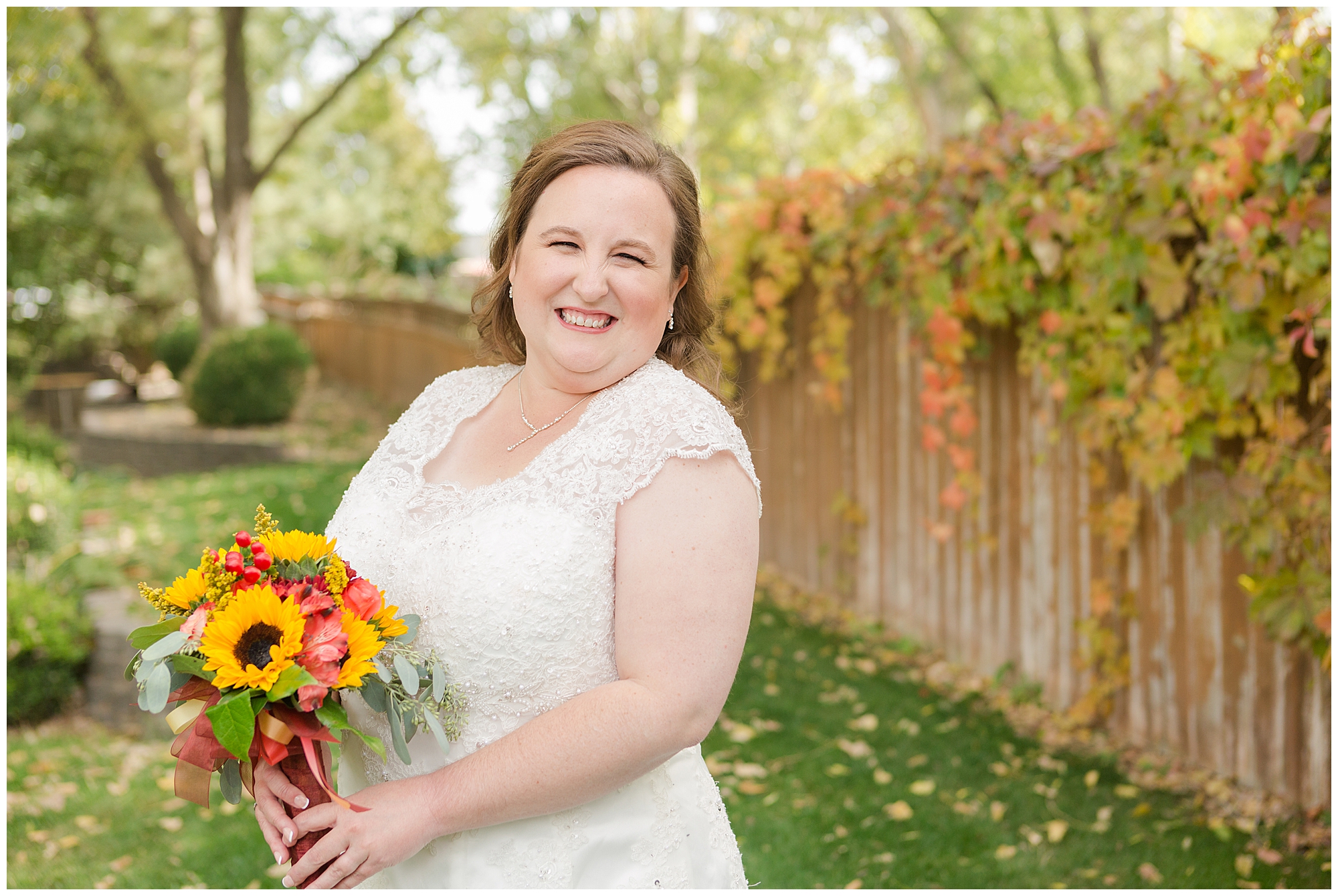 Smiling bride with her autumn bouquet at Calvary Chapel in Nampa, Idaho