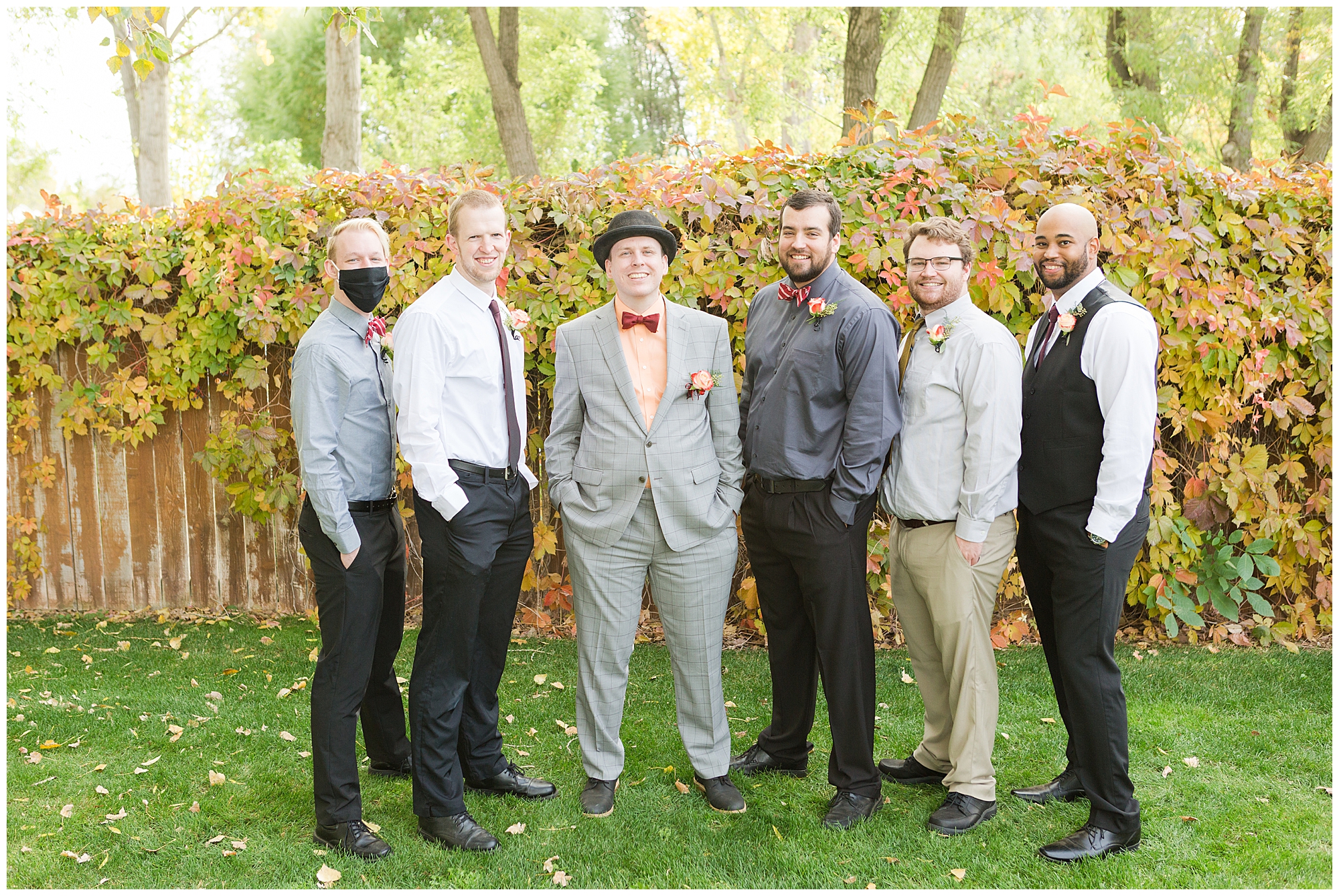 The groom and groomsmen in a traditional portrait arrangement