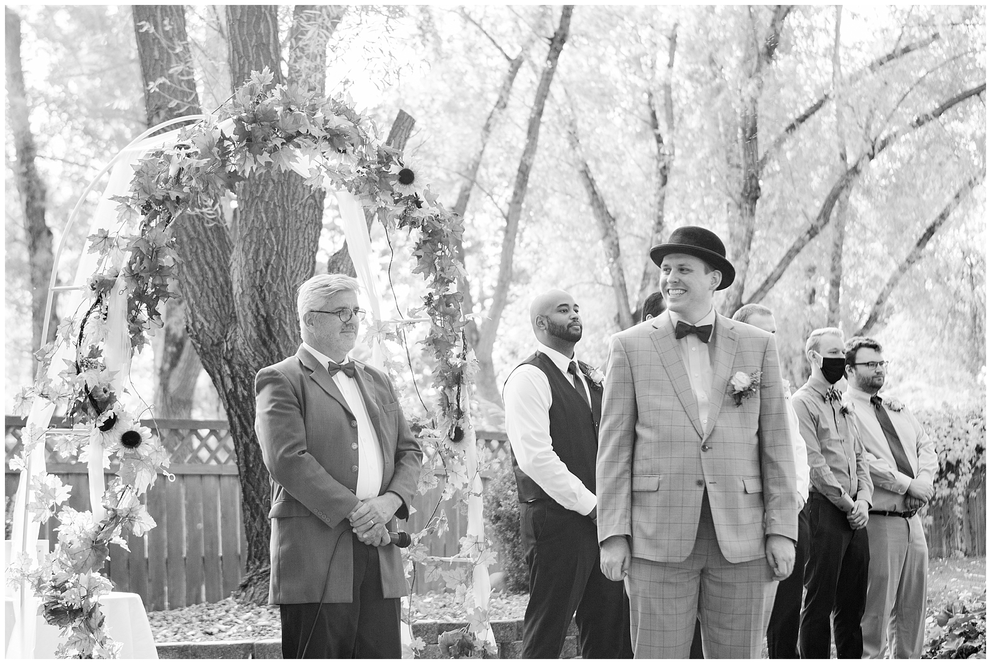 Groom smiling after seeing his bride walk down the aisle