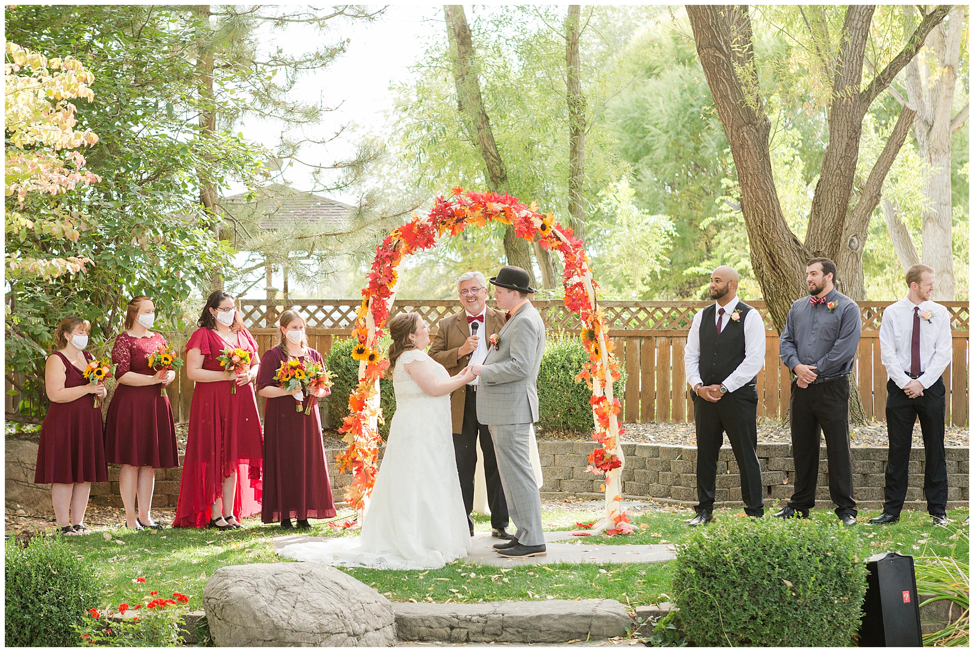 The wedding party laughs during the ceremony