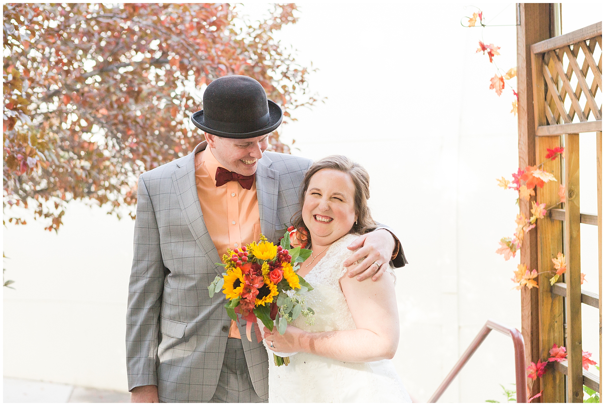 The bride and groom share a laugh after the wedding ceremony