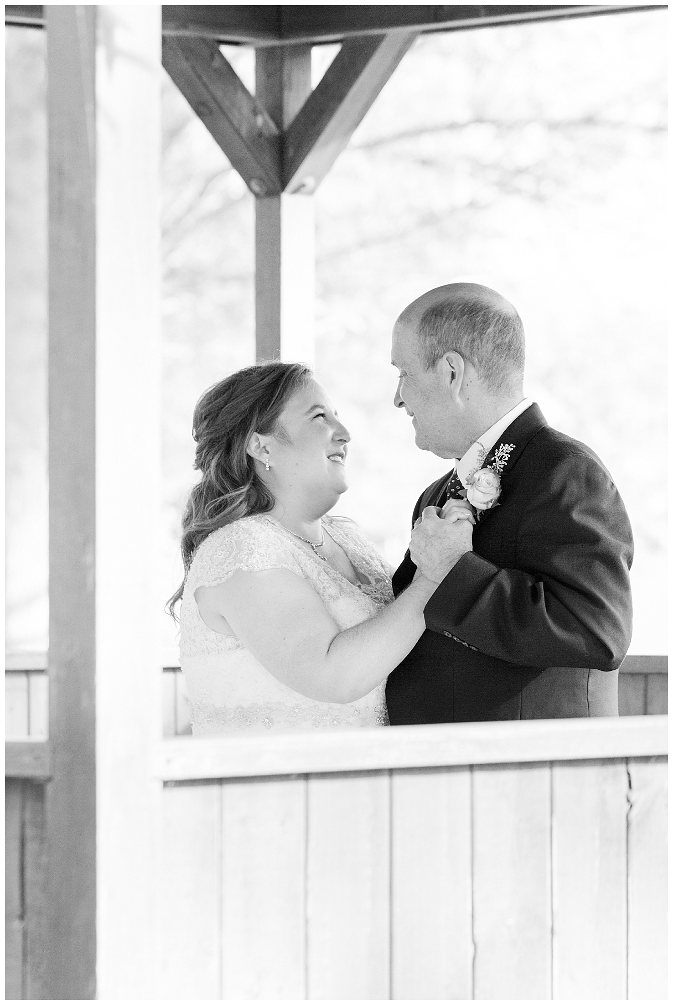 The bride and her father smiling during the father-daughter dance