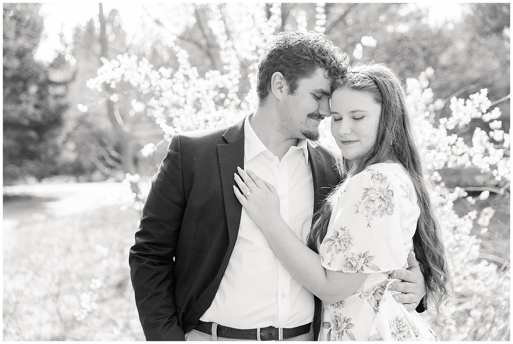 Engagement portrait of a couple in a park