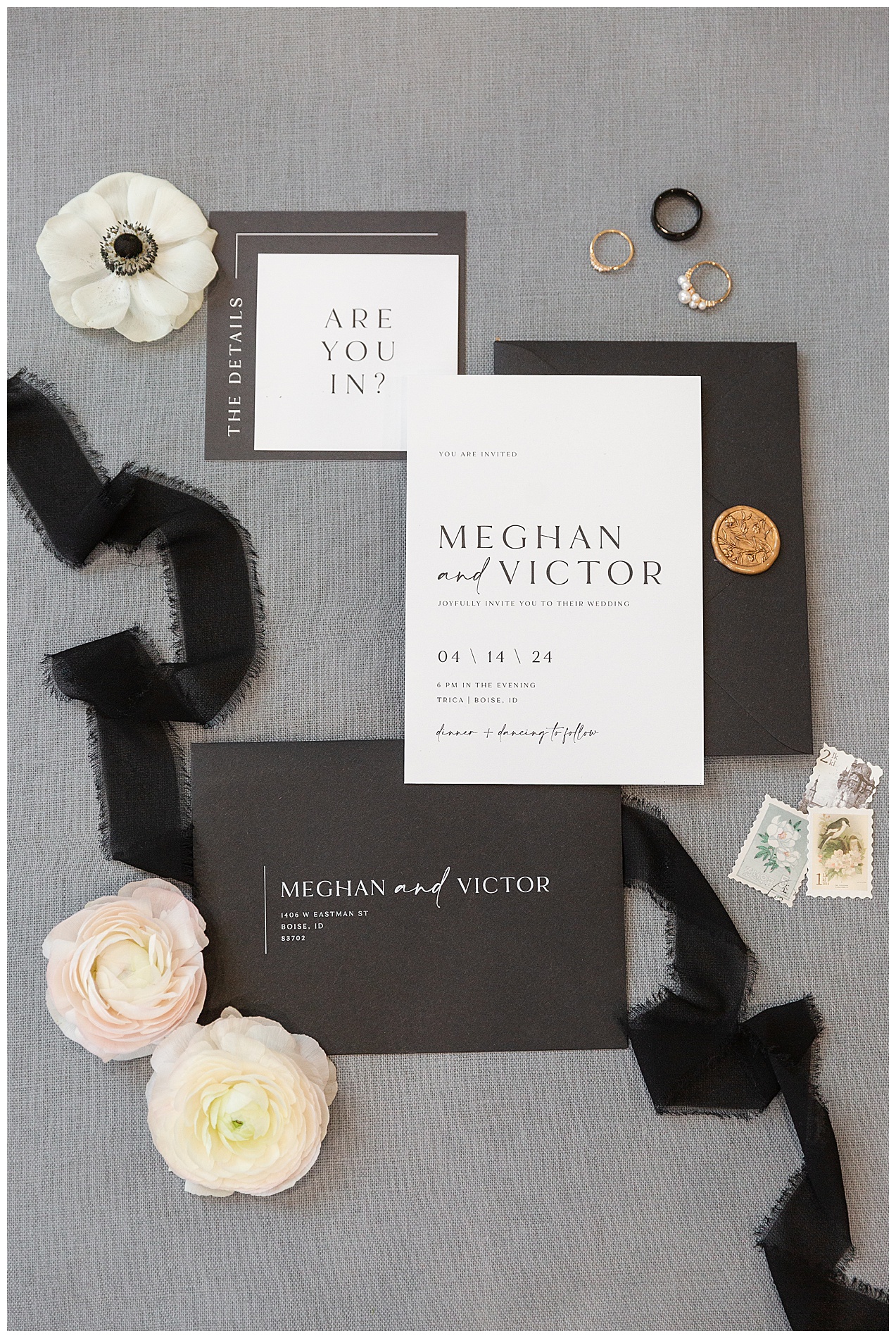 The couple's wedding invitation stationery: an invitation, RSVP card, information card, and two envelopes showing the recipient's address on one side and the wax seal on the other