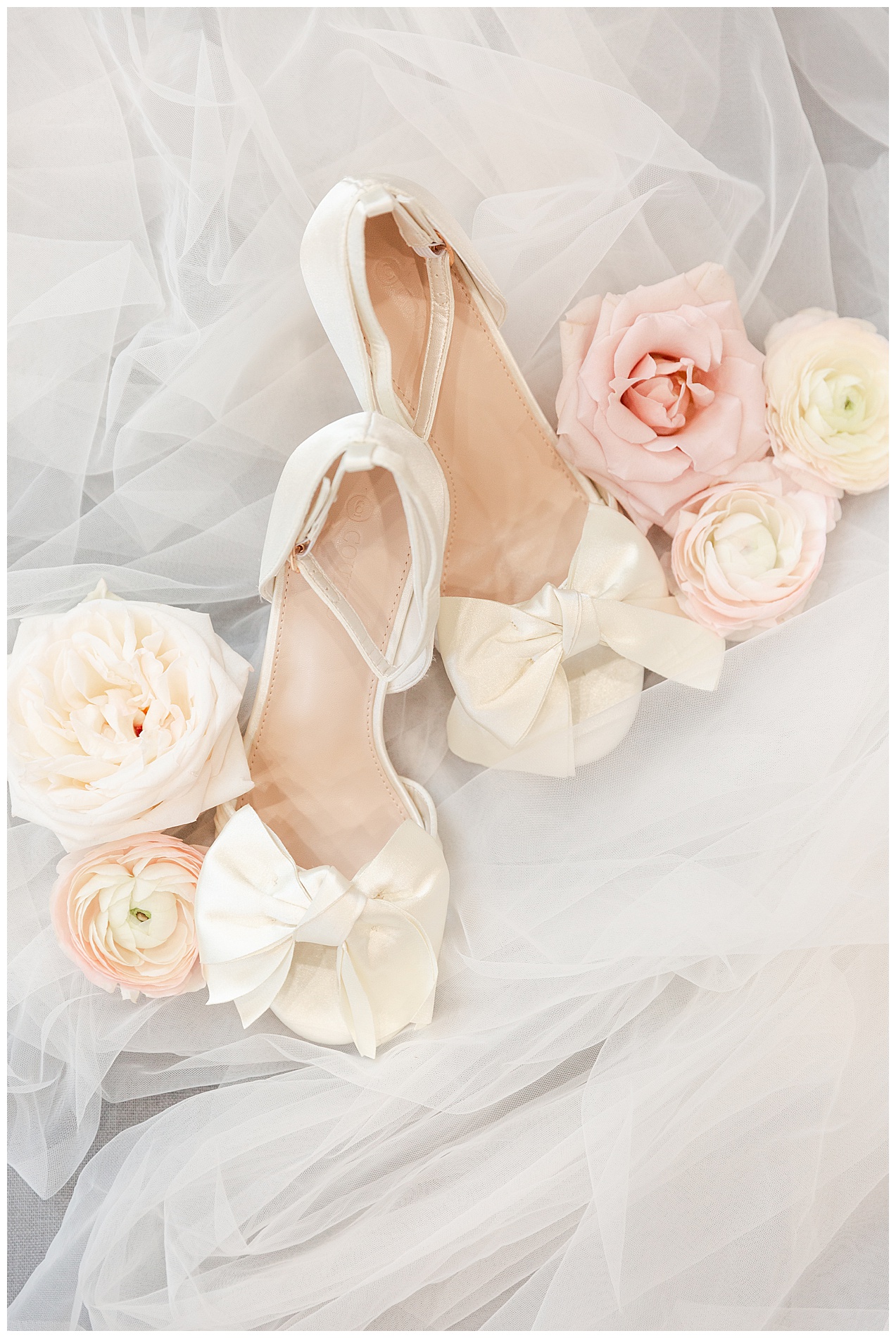 The bride's shoes arranged with flowers