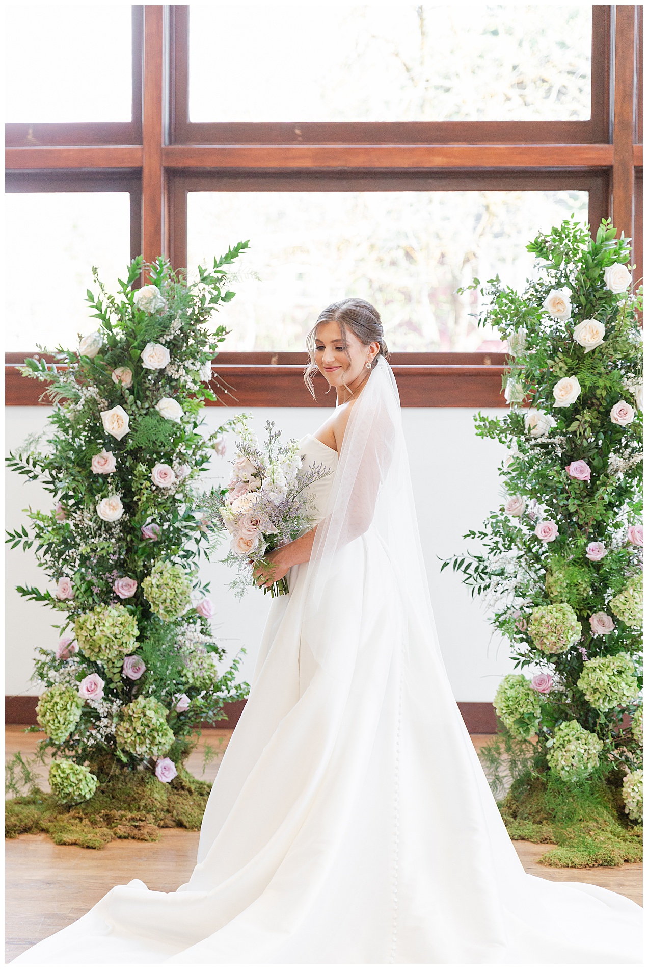 The bride with her veil and train all stretched out