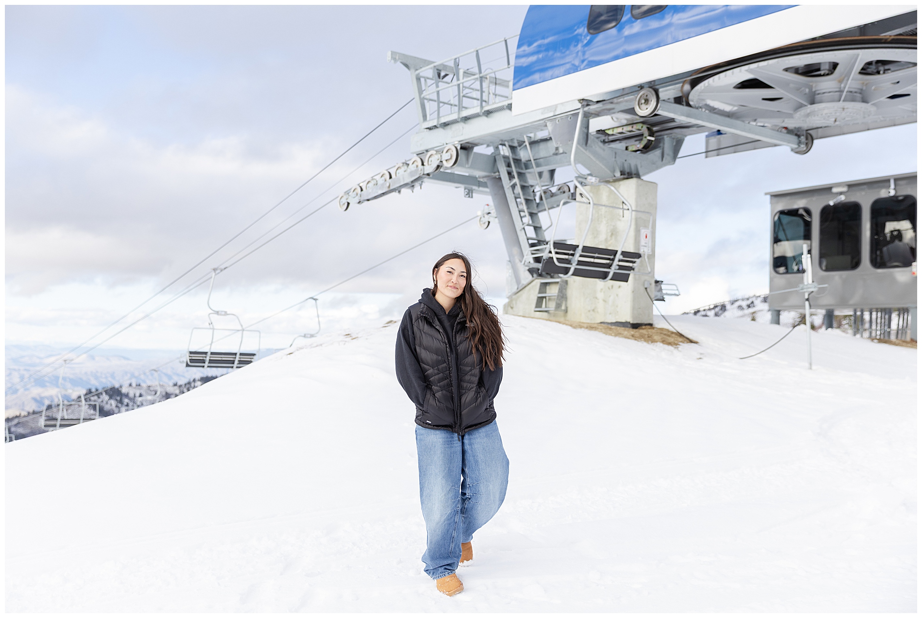 High school senior photo in front of a ski lift