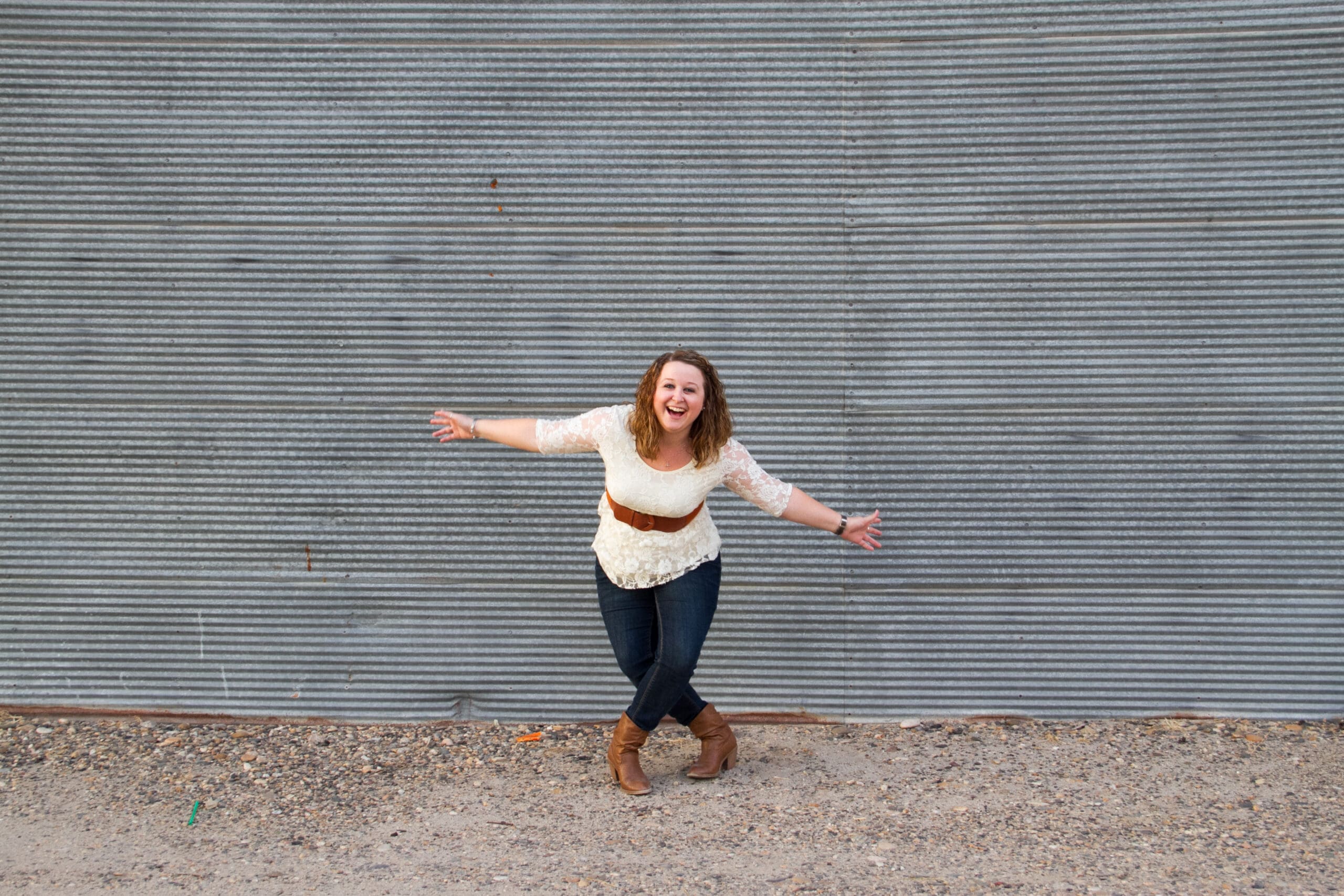 A girl in front of a metal building in downtown Ontario, Oregon