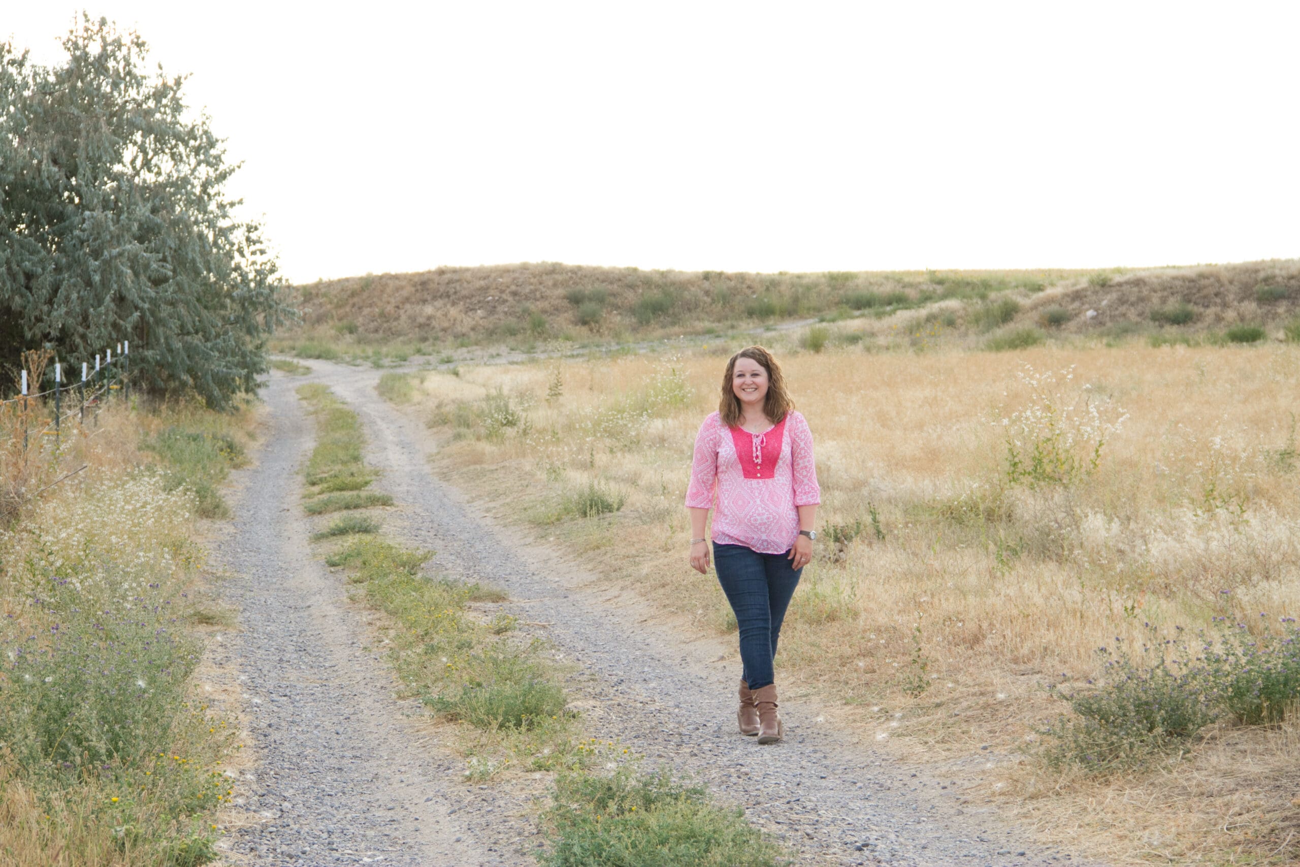 Girl walking a country road in Ontario, Oregon