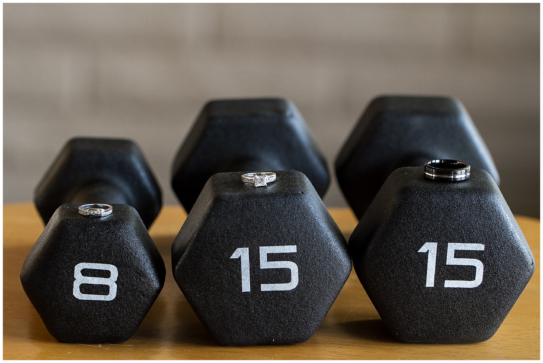 Wedding rings on dumbbells, which spell out the wedding date: 8-15-15