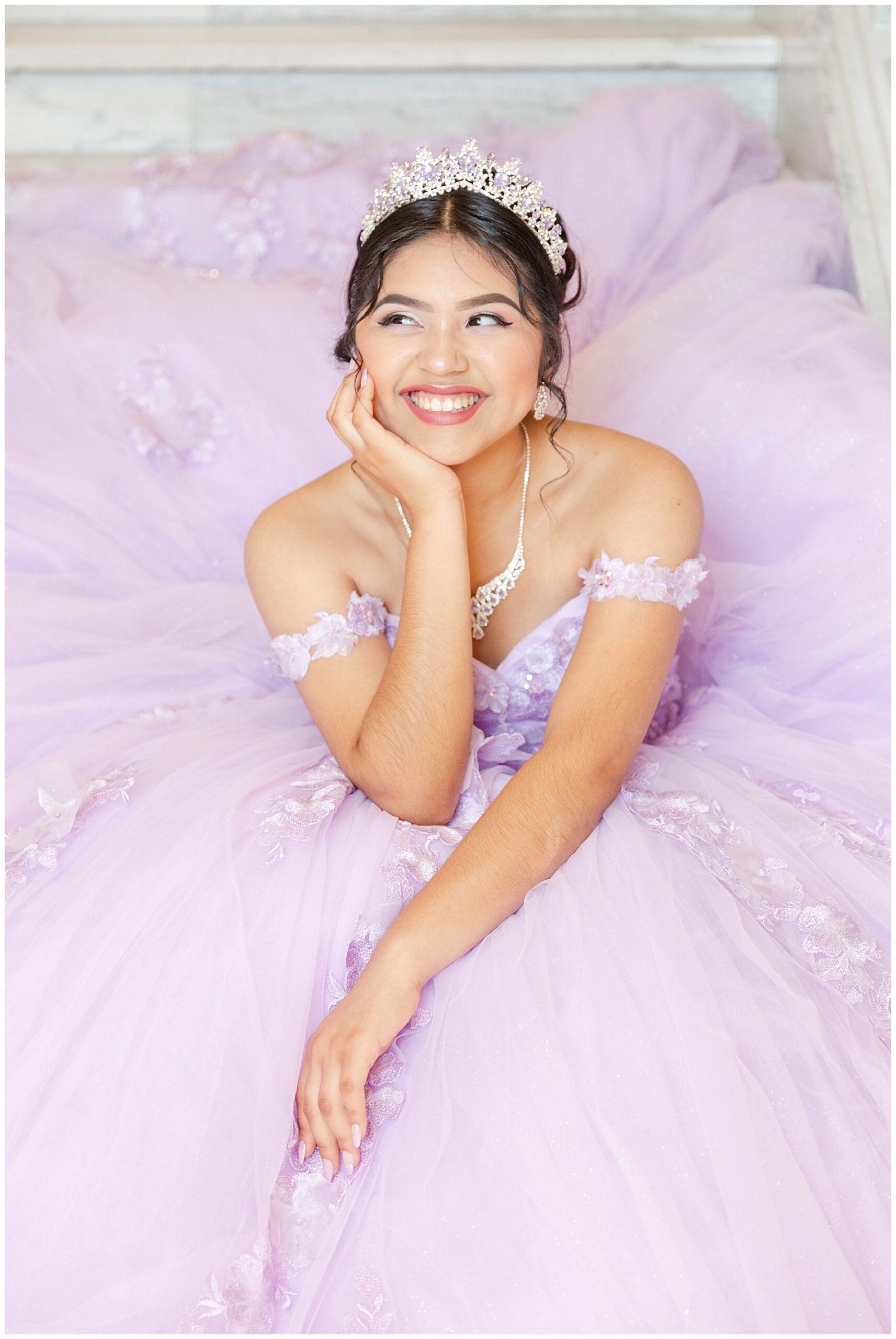 Portrait of a smiling quinceañera dress at the Capitol in Boise