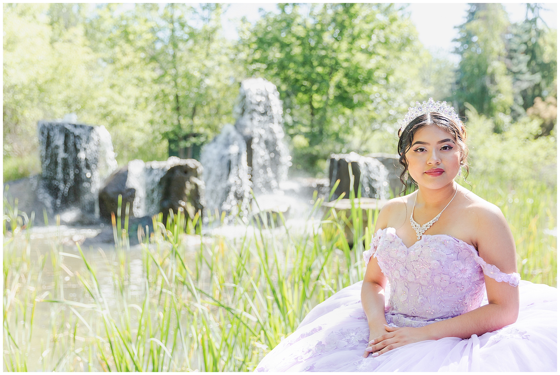 Girl in light purple dress by the Albertson Park water fountain