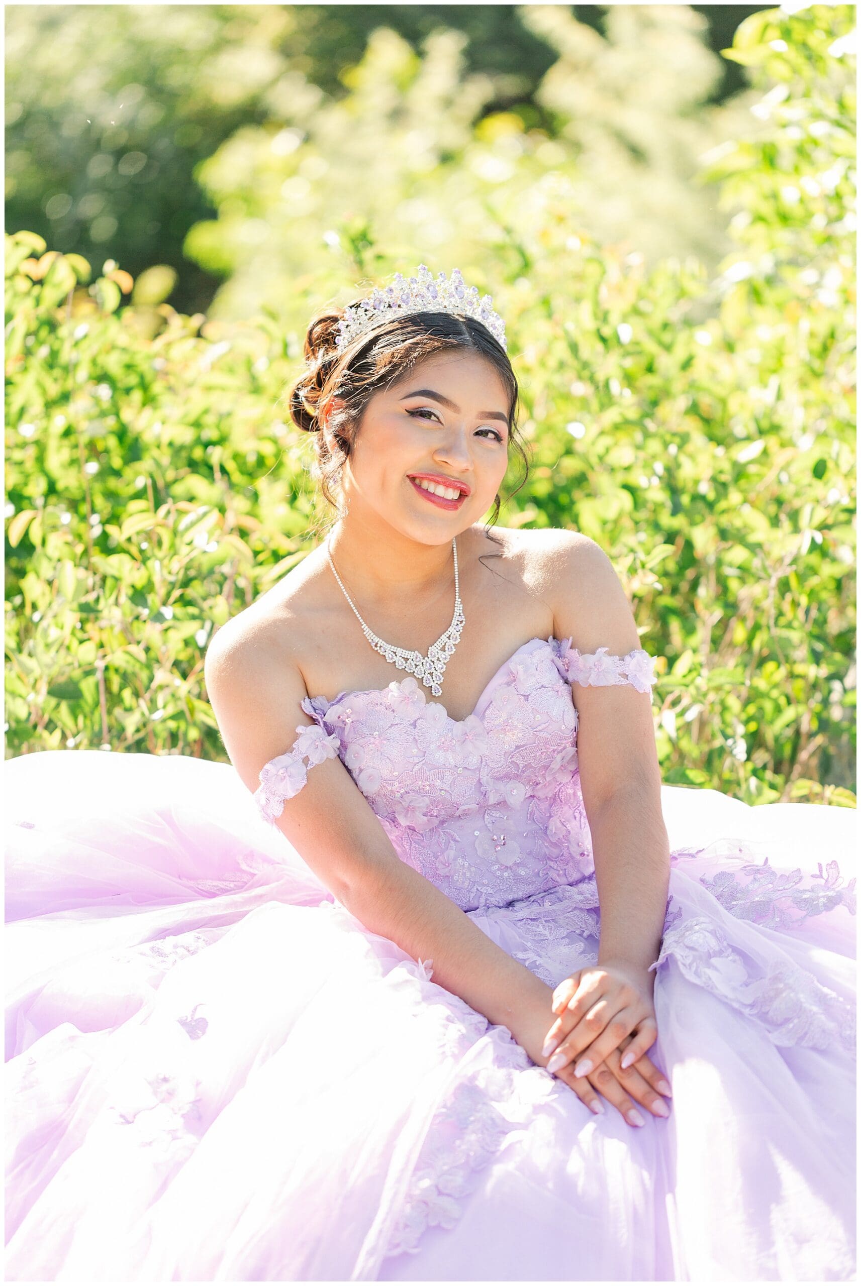 Quinceañera in her purple dress on bench at Albertson Park in Boise, Idaho