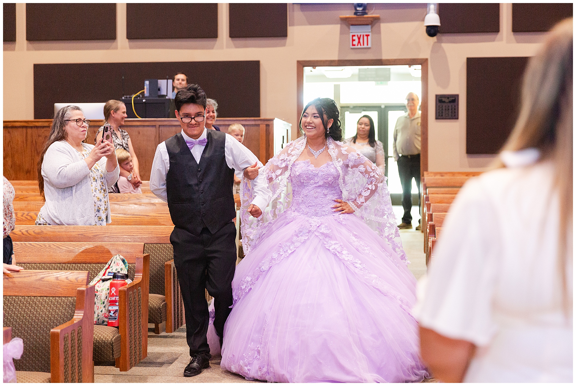 Quinceañera enters the sanctuary with her chambelan as part of the religious ceremony