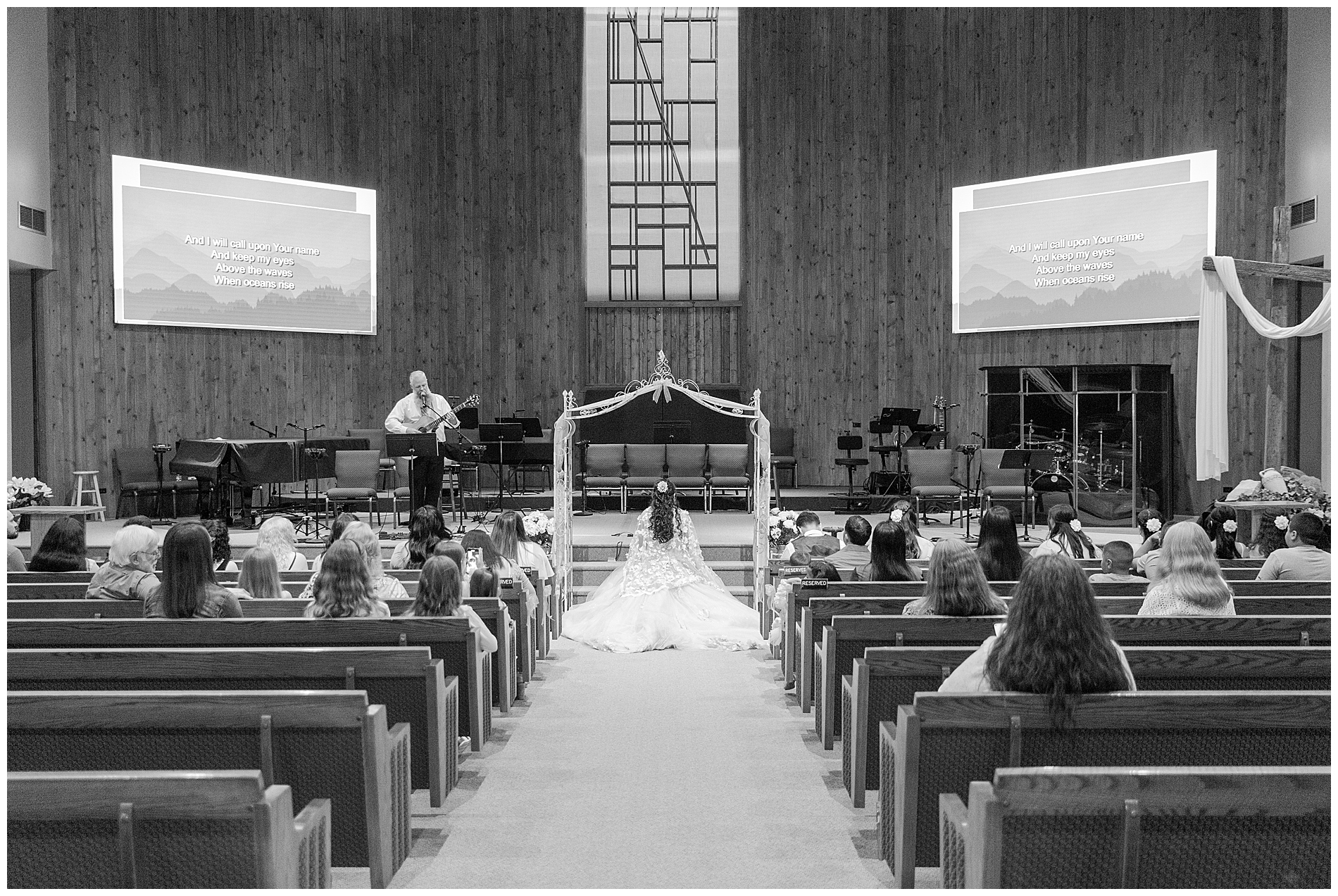 Everyone in the church sanctuary for the quinceañera religious ceremony