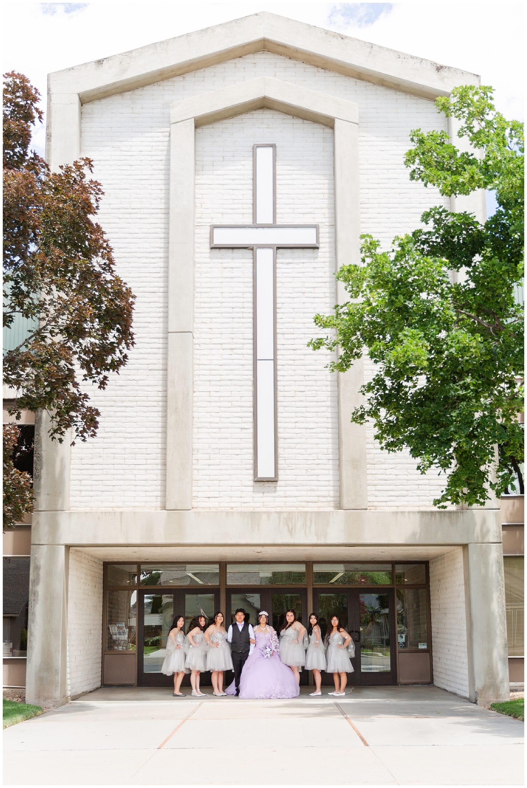 Ana with her damas and chambelan outside the church