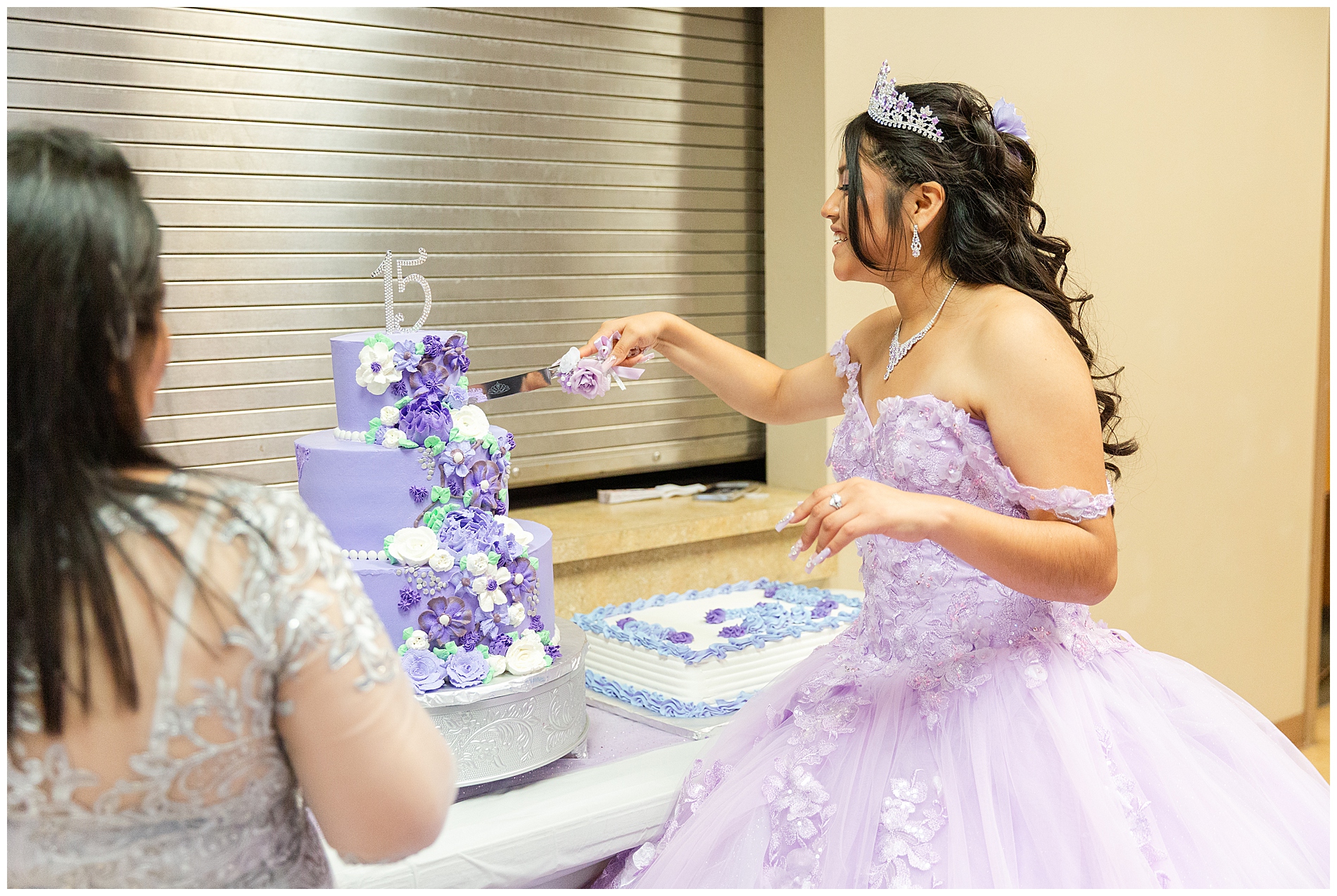 The quinceañera cut the cake herself to serve to her guests