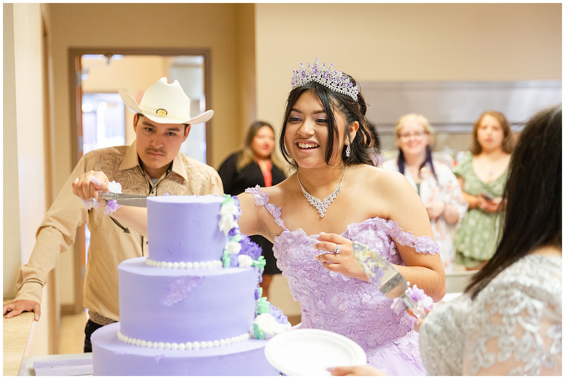 Cutting the quinceañera cake